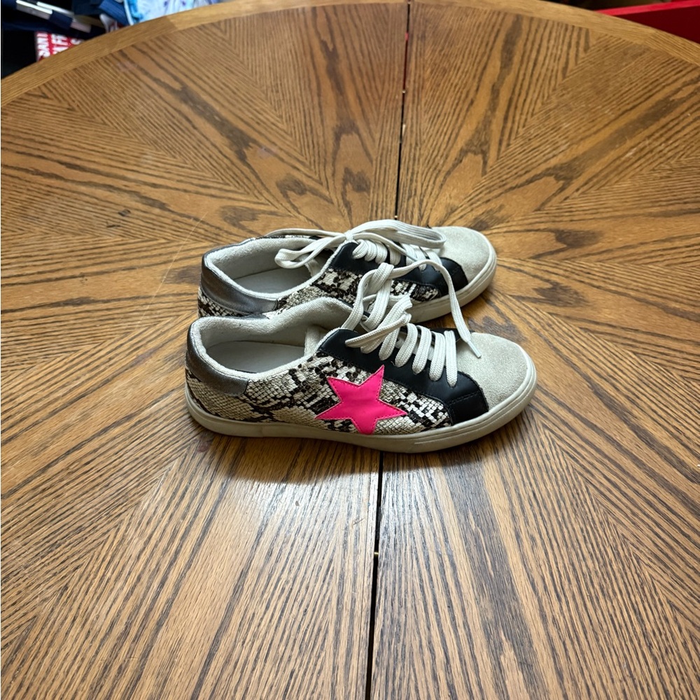Steven by Steve Madden Rubie snake print sneakers with a pink star detail.